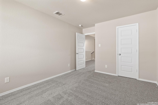 empty room with carpet flooring