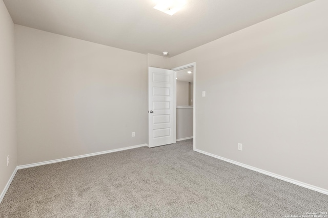 spare room featuring carpet flooring