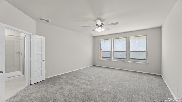 spare room with light carpet and ceiling fan