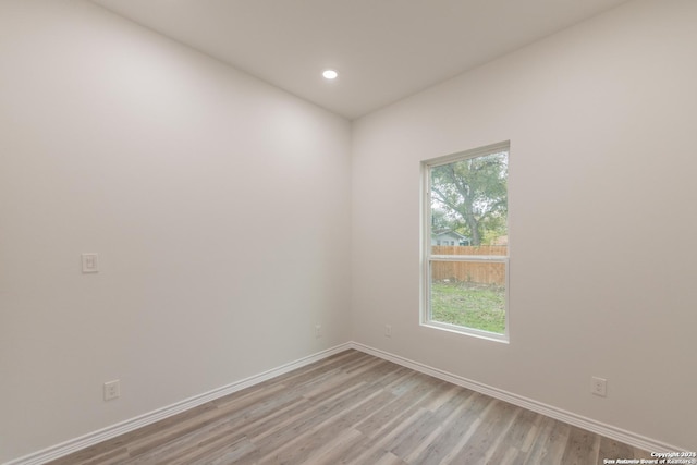 spare room with light wood-type flooring