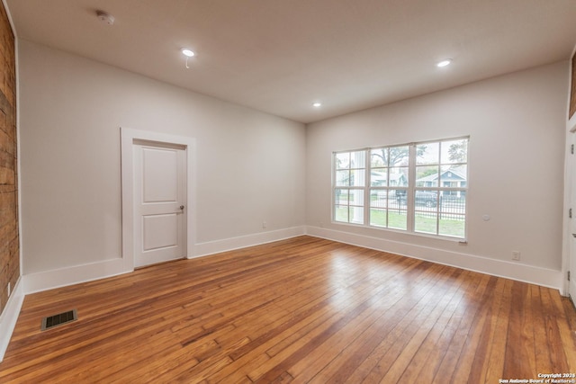 unfurnished room featuring light wood-type flooring