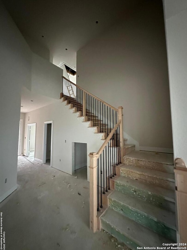 stairway with a towering ceiling