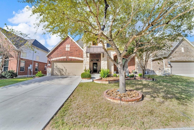 view of front of property with a garage and a front lawn