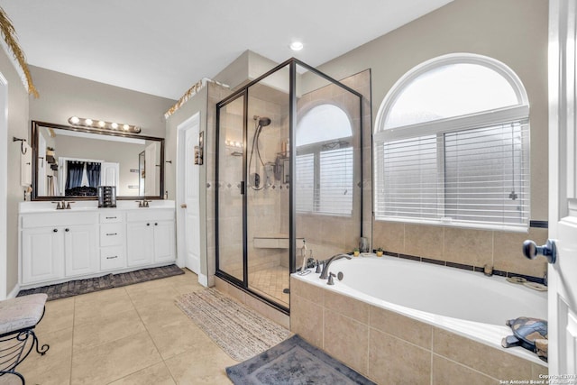 bathroom with plus walk in shower, vanity, and tile patterned floors