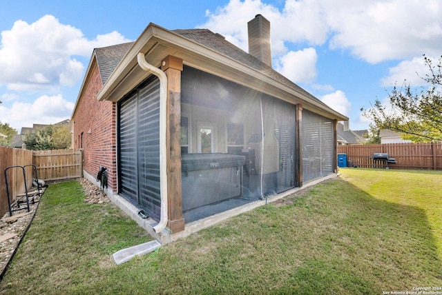 view of home's exterior with a yard