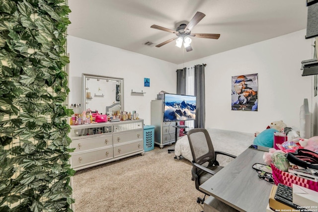 carpeted office featuring ceiling fan