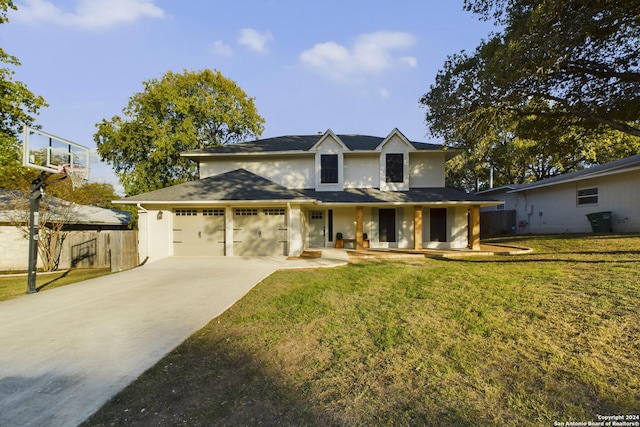 view of front facade featuring a garage, covered porch, and a front lawn