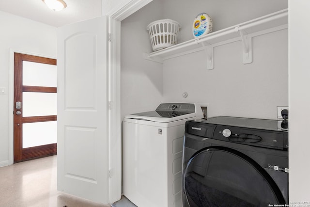 clothes washing area featuring a healthy amount of sunlight and independent washer and dryer