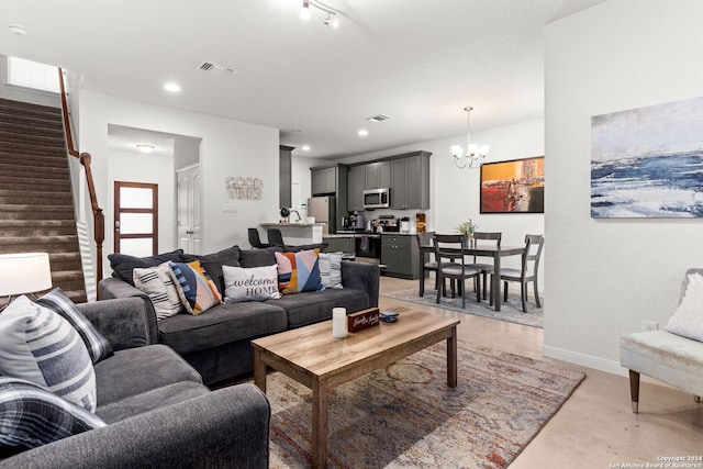 living room featuring a notable chandelier