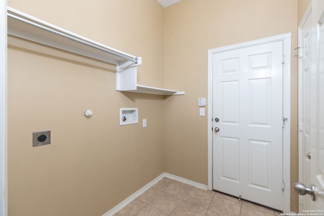 laundry room with hookup for an electric dryer, washer hookup, and light tile patterned flooring