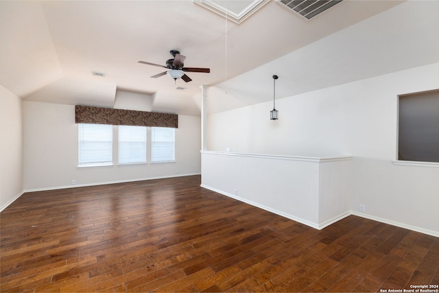 unfurnished room featuring ceiling fan, dark hardwood / wood-style flooring, and lofted ceiling