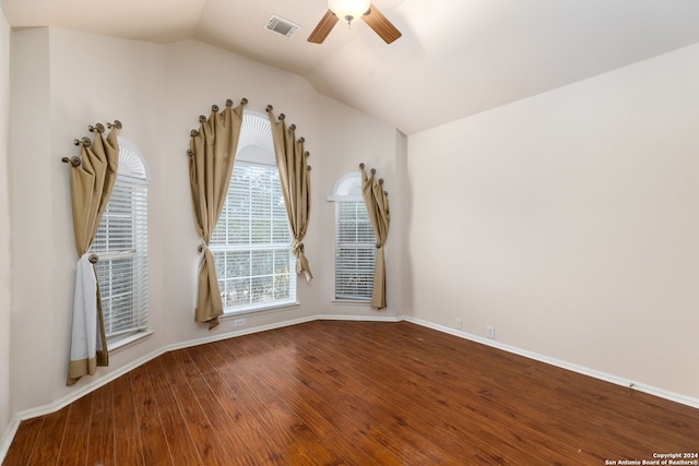 spare room with hardwood / wood-style flooring, ceiling fan, and lofted ceiling