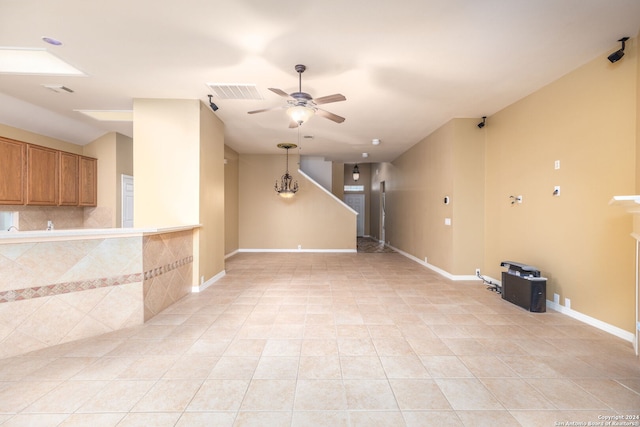 interior space featuring ceiling fan and light tile patterned flooring