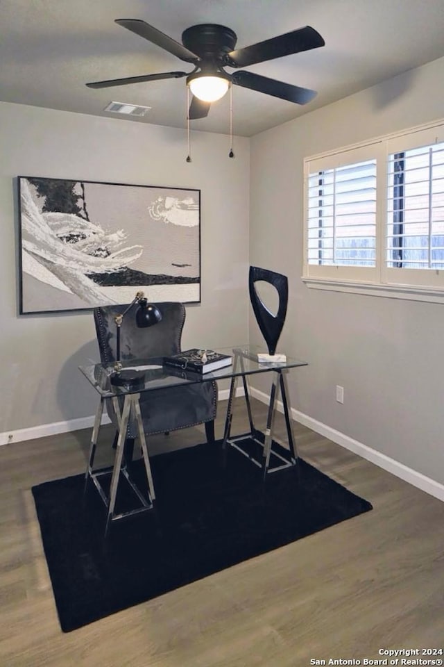 office area featuring ceiling fan and dark wood-type flooring