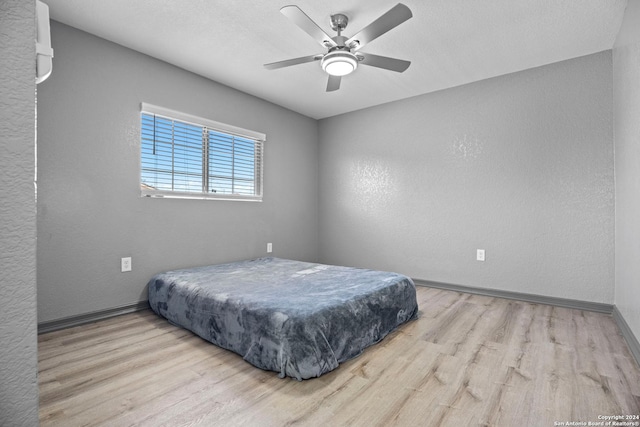 bedroom featuring ceiling fan and light wood-type flooring