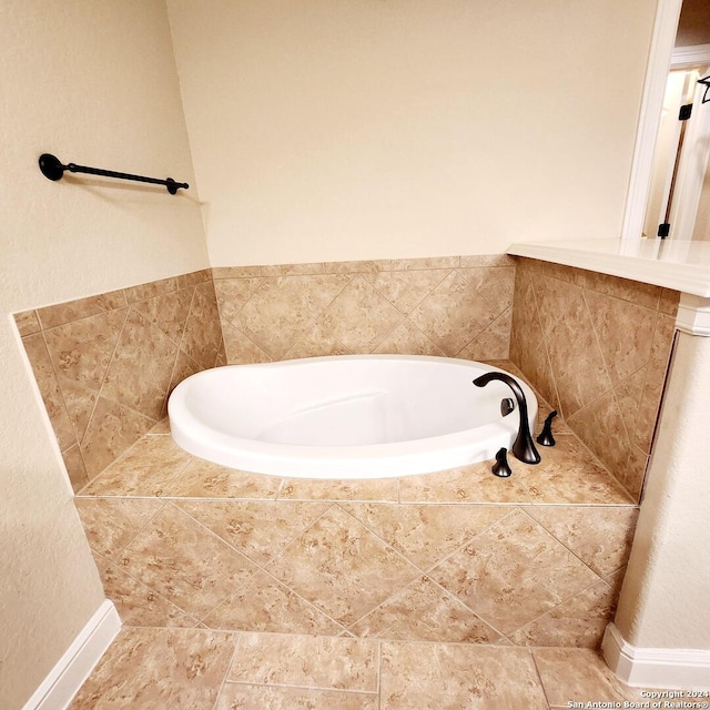 bathroom featuring tiled bath