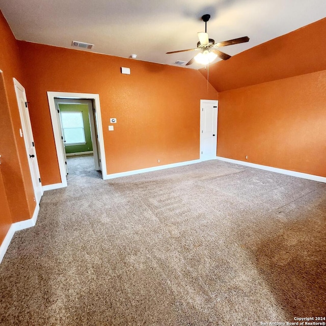 unfurnished room featuring carpet flooring, ceiling fan, and lofted ceiling