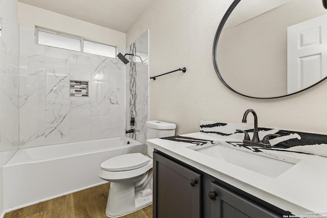 352 Solitaire Path, New Braunfels, TX 78130 - bathroom featuring wood finished floors, vanity, toilet, and tub / shower combination