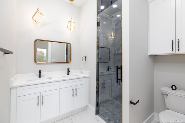 bathroom with vanity, toilet, and a shower with door