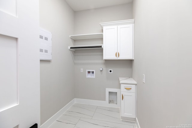 laundry room featuring cabinets, washer hookup, gas dryer hookup, and electric dryer hookup