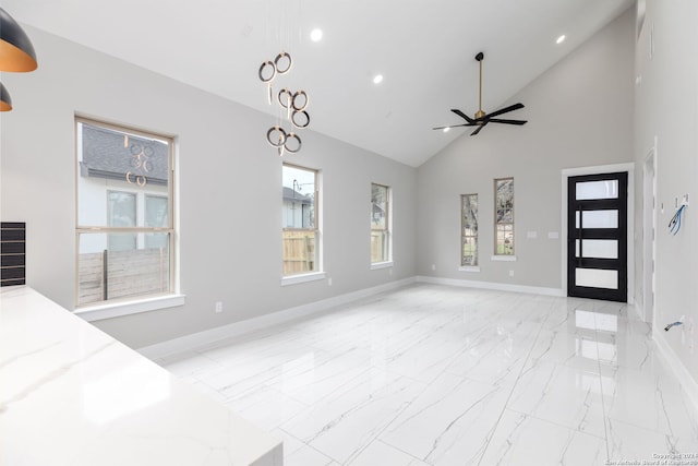 interior space with ceiling fan and high vaulted ceiling