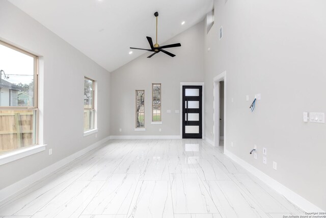 interior space featuring high vaulted ceiling and ceiling fan