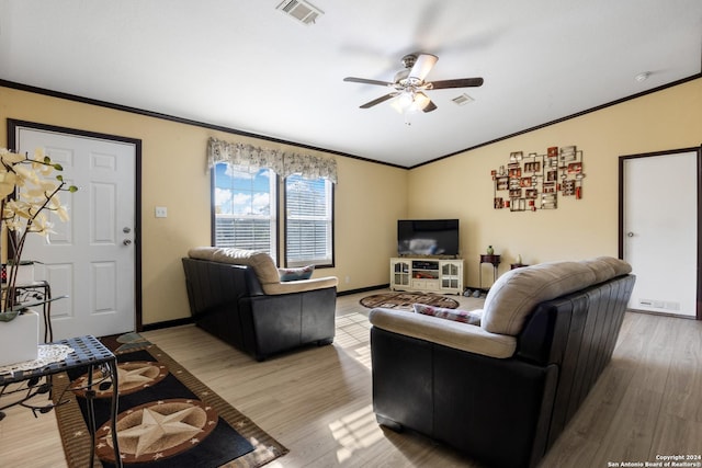 living room with hardwood / wood-style floors, ceiling fan, and ornamental molding