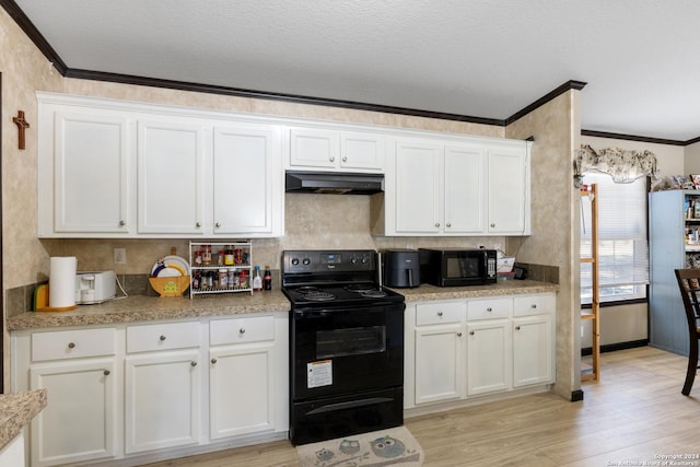 kitchen with crown molding, white cabinets, black appliances, and light wood-type flooring