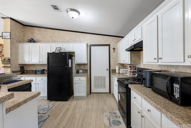 kitchen featuring black appliances, vaulted ceiling, a textured ceiling, light hardwood / wood-style floors, and white cabinetry