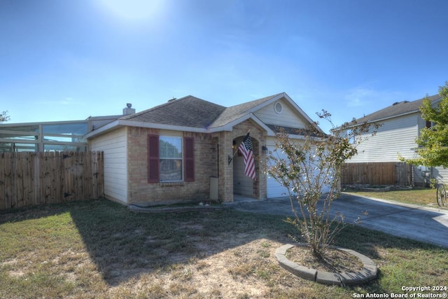 view of front facade with a garage and a front yard