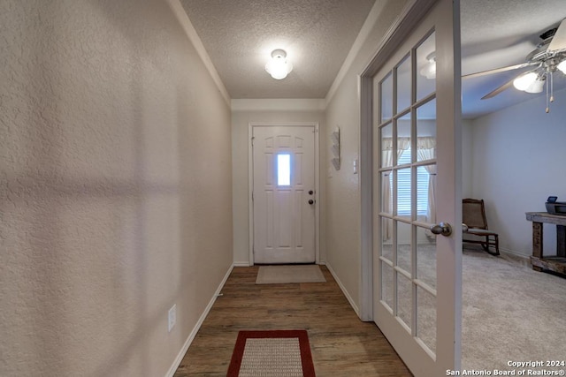 doorway with hardwood / wood-style flooring, ceiling fan, a textured ceiling, and french doors