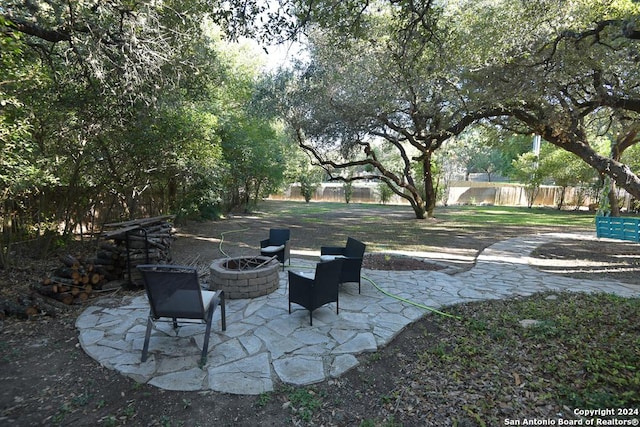 view of patio / terrace with an outdoor fire pit