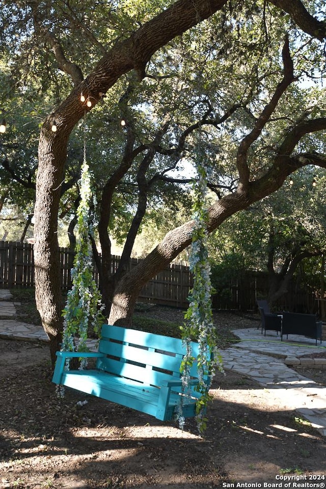 surrounding community with a patio area