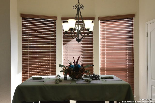 dining space featuring plenty of natural light and a chandelier