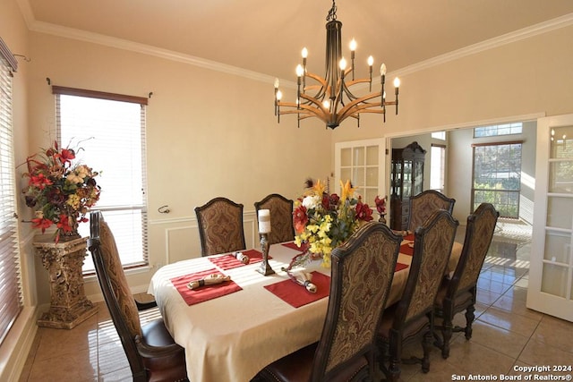 tiled dining area with an inviting chandelier and ornamental molding