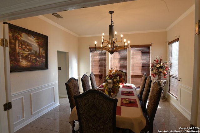 dining room with light tile patterned flooring, a chandelier, and ornamental molding