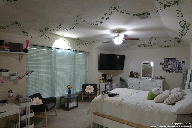 bedroom featuring light carpet and ceiling fan