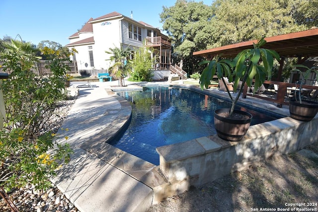 view of swimming pool with a patio