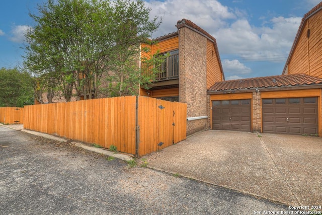 view of side of property with a balcony