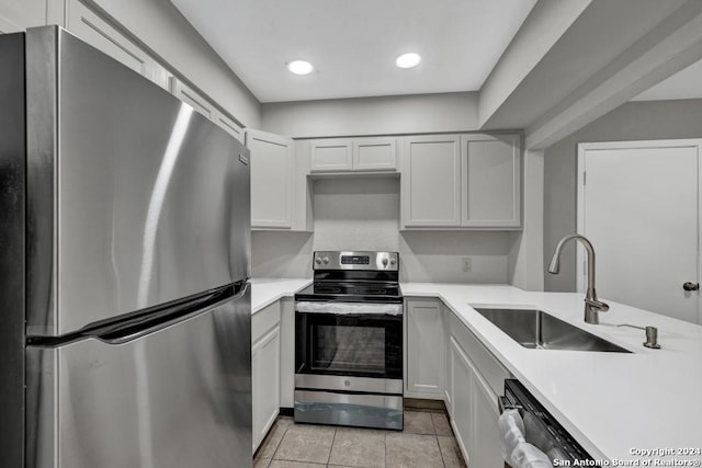 kitchen with sink, white cabinetry, and stainless steel appliances