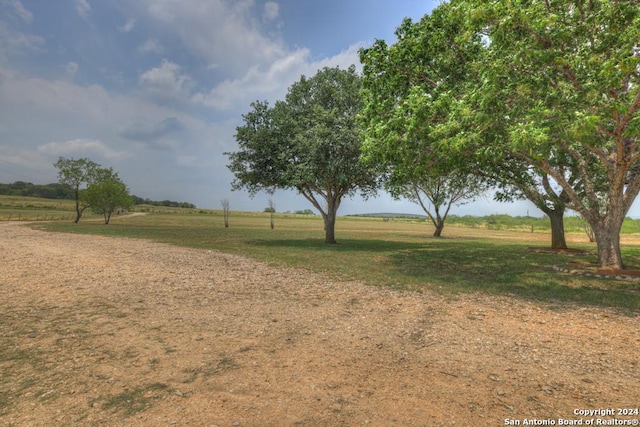 view of yard with a rural view