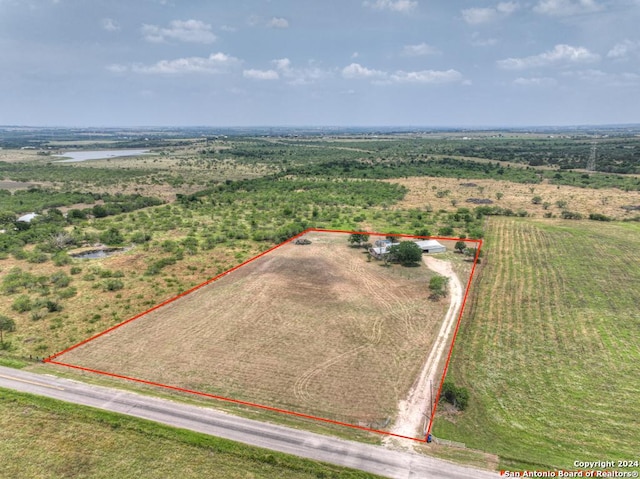 birds eye view of property featuring a rural view