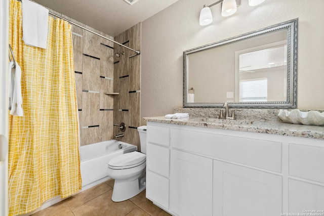 full bathroom featuring vanity, tile patterned floors, shower / bath combination with curtain, toilet, and a textured ceiling