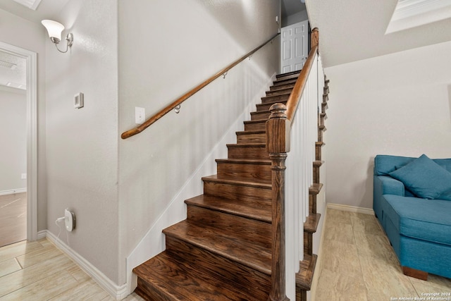 staircase featuring hardwood / wood-style floors