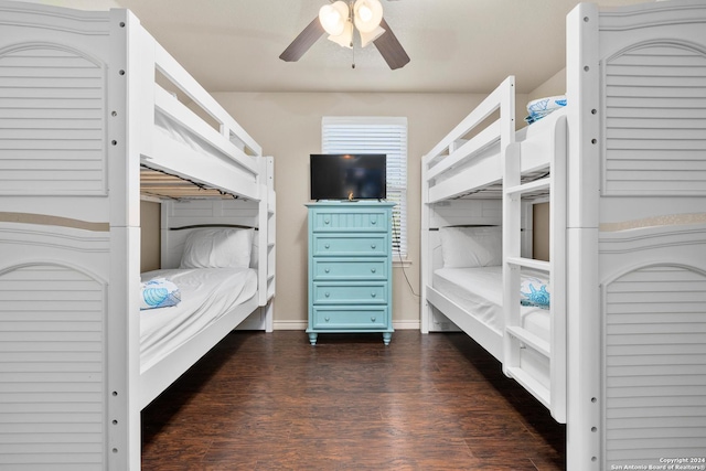 bedroom featuring ceiling fan and dark hardwood / wood-style floors