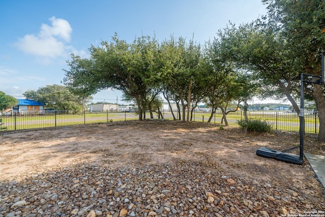 view of yard with a rural view