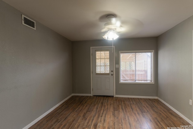 interior space featuring ceiling fan and dark hardwood / wood-style floors