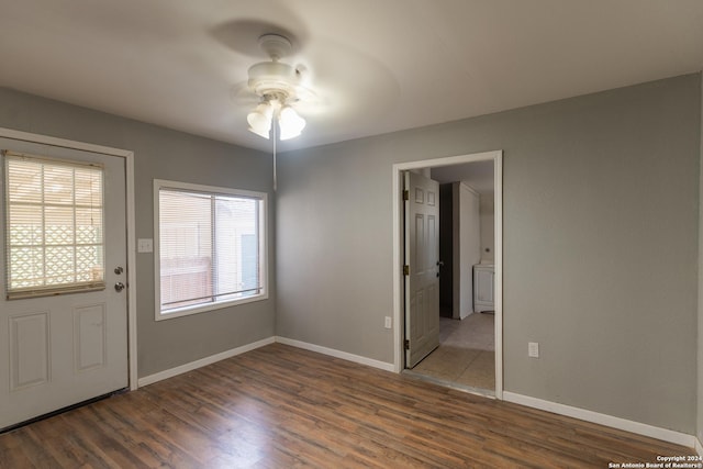 interior space featuring ceiling fan and dark hardwood / wood-style flooring