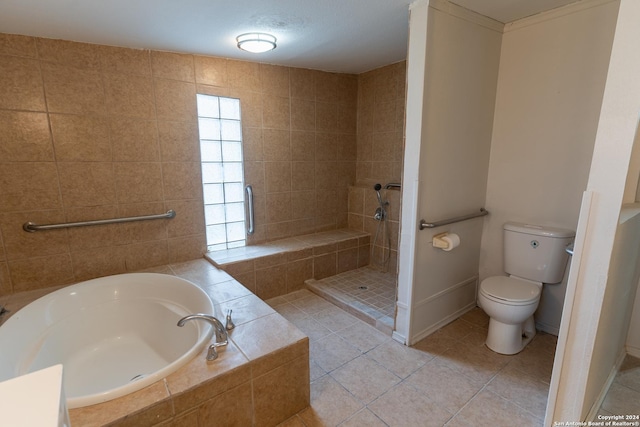 bathroom with tile patterned flooring, a textured ceiling, separate shower and tub, and toilet