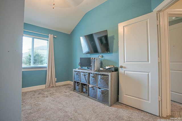 interior space featuring ceiling fan and lofted ceiling